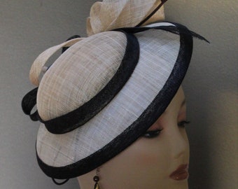 New women's Saucer Percher Fascinator/Hat, Alexander & Hallatt in Cream Sinamay and Black with Brown Arrow feather