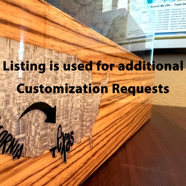 May include: A wooden box with a light brown wood grain finish featuring a map of the United States. The text "Listing is used for additional Customization Requests" is overlaid. A black arrow points from the word "California" toward "Texas".