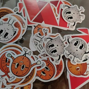 May include: A collection of colorful stickers featuring cartoon clocks with different expressions. The stickers are on a white background and some have the words "Time Always" and "Time Waits for No One" on them.