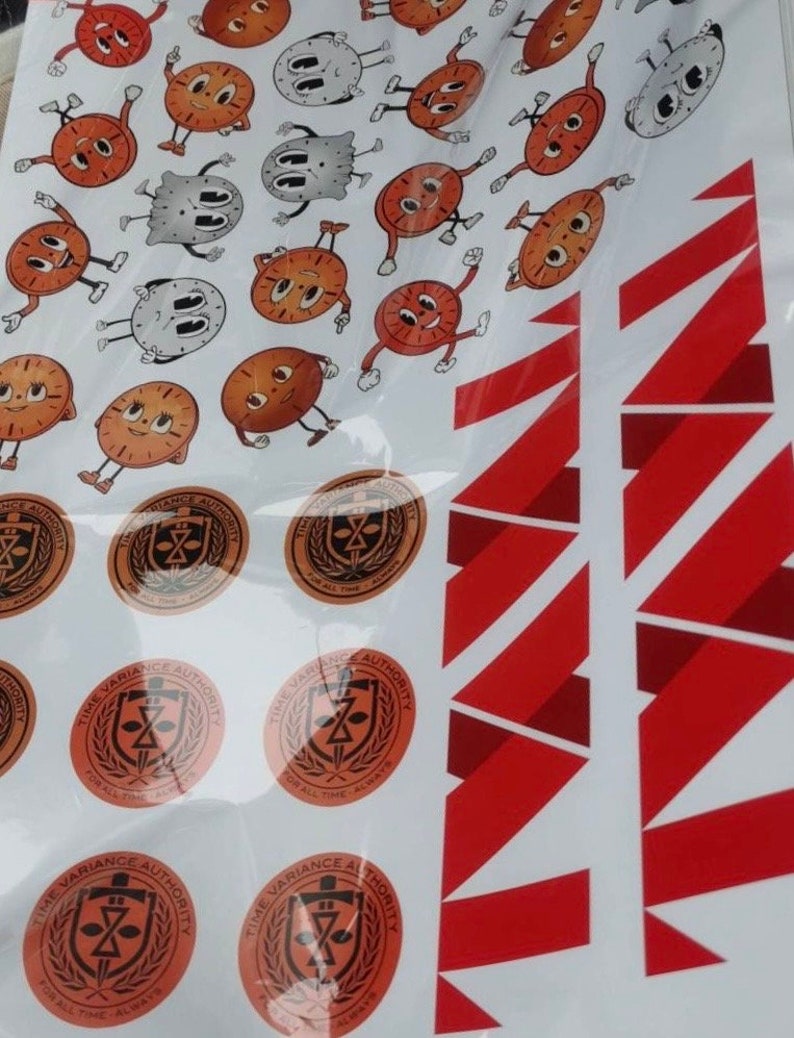 May include: A sheet of stickers featuring cartoon clocks with various facial expressions. The stickers are arranged in a random pattern. The sheet also includes several circular stickers with the text "Time Variance Authority" and a sword and shield logo.