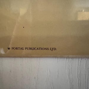 May include: A close-up of a section of a framed print with a light brown background. The text "PORTAL PUBLICATIONS LTD." is printed in dark brown at the bottom left corner.