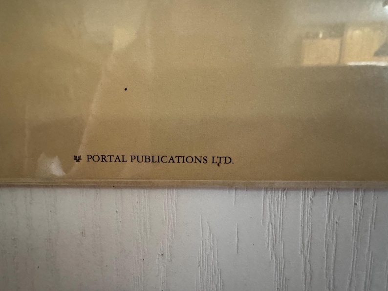 May include: A close-up of a section of a framed print with a light brown background. The text "PORTAL PUBLICATIONS LTD." is printed in dark brown at the bottom left corner.