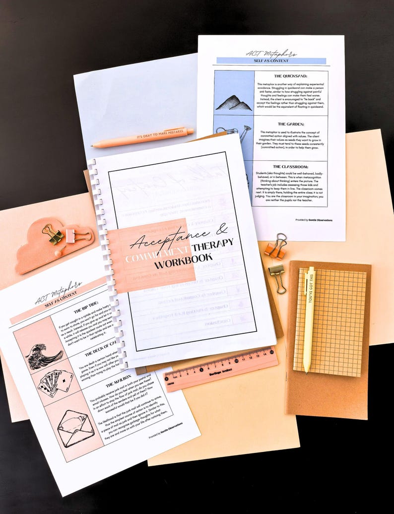 various items related to therapy and self-care, including a notebook, a ruler, a pen, a stapler, and some papers.