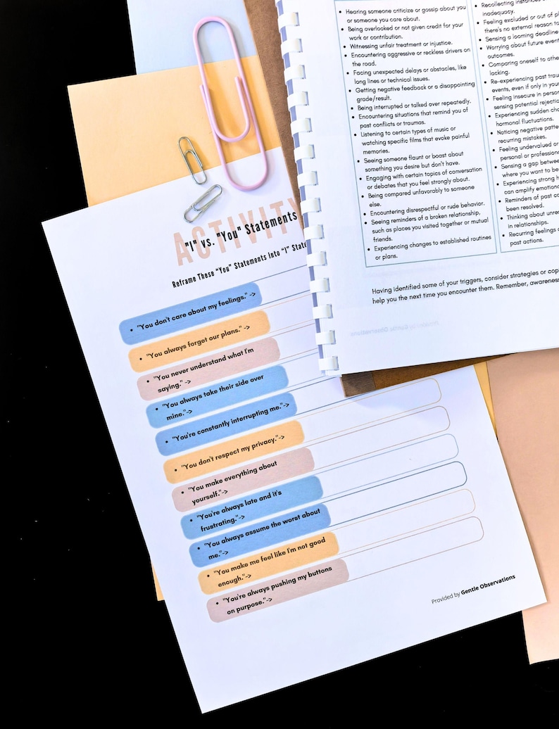 a printed worksheet titled "I'm Your Statement" with a list of statements and a color-coded chart for self-reflection. There is also a printed page with a pink paper clip and a yellow paper clip, along with a list of statements.