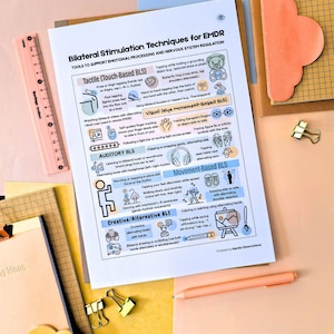 May include: A printed sheet titled "Bilateral Stimulation Techniques for EMDR" with diagrams and text, including "Tactile," "Auditory," and "Movement-Based BLS." The sheet is on a light pink surface with a pink ruler, a peach-colored pen, and gold paper clips.