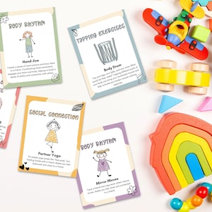 A playful setup of Somatic Therapy Coping Skill Cards next to colorful children's toys, aimed at improving nervous system health and sensory processing.