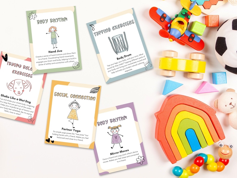 A playful setup of Somatic Therapy Coping Skill Cards next to colorful children's toys, aimed at improving nervous system health and sensory processing.