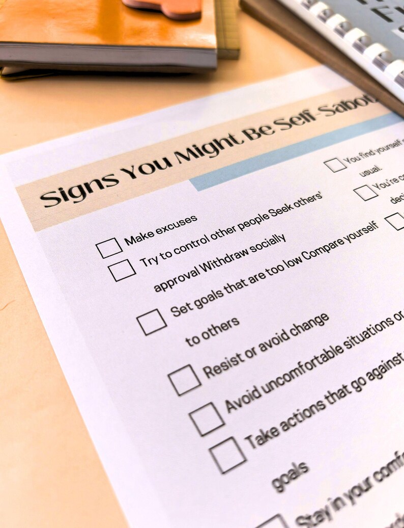 a close-up view of a document titled "Signs You Might Be Self-Sufficient" with a list of personal development goals and behaviors.