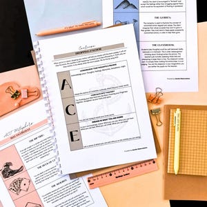 various educational materials, including a notebook, a worksheet, and a ruler, all arranged on a desk.