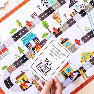 May include: A board game with a colorful illustration of a city street with buildings, fire hydrants, and a fire truck. The game board includes a card that says "Name a coping skill that involves mindfulness or meditation."