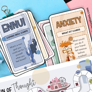 May include: A stack of coping skill cards with the words "ENNUI" and "ANXIETY" printed on them. The "ENNUI" card asks "What's a mini goal you could set for yourself when you feel bored?" The "ANXIETY" card asks "What would you do if your friend felt anxious before a school?"