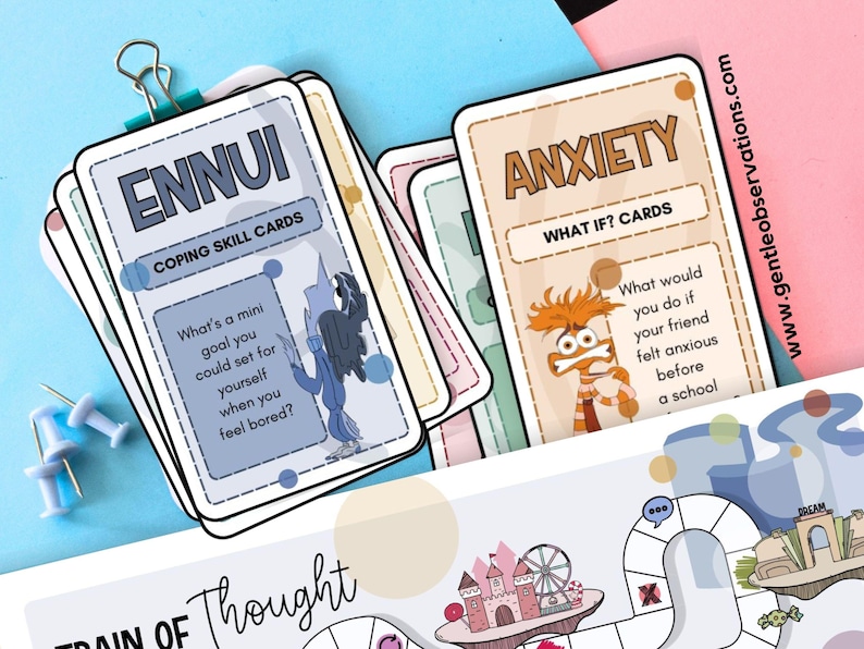 May include: A stack of coping skill cards with the words "ENNUI" and "ANXIETY" printed on them. The "ENNUI" card asks "What's a mini goal you could set for yourself when you feel bored?" The "ANXIETY" card asks "What would you do if your friend felt anxious before a school?"