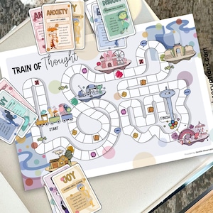 May include: A board game titled "Train of Thought" with a colorful illustrated game board and cards. The game board features a path with various illustrations, including a train, a ferris wheel, and a castle. Cards with words like "Anxiety" and "Joy" are included.