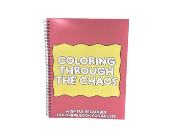 May include: A spiral-bound coloring book with a pink cover featuring a yellow scalloped shape in the center. The text reads COLORING THROUGH THE CHAOS and A SIMPLE RELATABLE COLORING BOOK FOR ADULTS in bold white letters with black outlines.