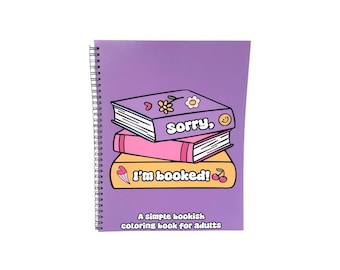 May include: A spiral-bound coloring book with a purple cover featuring a stack of three illustrated books. The top book is purple with the text sorry, the middle is pink, and the bottom is yellow with the text I'm booked! and small icons.
