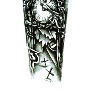 May include: Black and white temporary tattoo design featuring a detailed clock with Roman numerals, surrounded by ornate embellishments and figures. The design includes cross symbols and the text "Wanna Be Ink.com TEMPORARY TATTOOS".