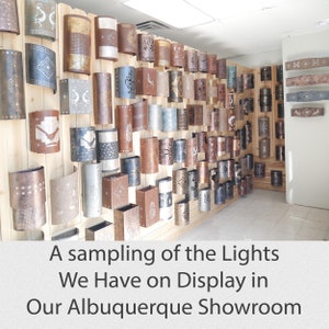 A small sampling of the Southwestern, western, rustic and nautical light fixtures we make and have on display in our Albuquerqe, NM showroom