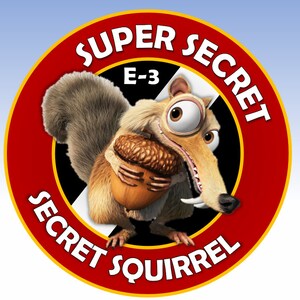 May include: A red and yellow circle with the words "Super Secret" and "Secret Squirrel" around the edge. In the center is a cartoon squirrel holding an acorn. The squirrel has a large eye and a toothy grin. The text "E-3" is visible in the upper left corner of the circle.