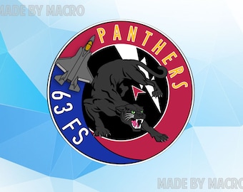 May include: A circular patch featuring a black panther, a gray jet, and the text "PANTHERS" and "63 FS". The patch has a red and blue border with a white lightning bolt design.