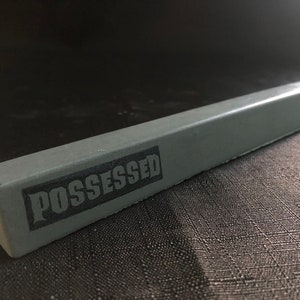 Possessed Concrete Curb with Cinderblocks