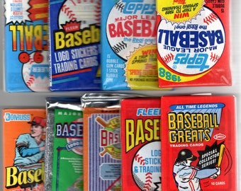 May include: A collection of vintage baseball trading cards featuring various brands like Topps, Fleer, and Donruss. The cards feature colorful designs with baseball players and logos. Some cards include bubble gum.