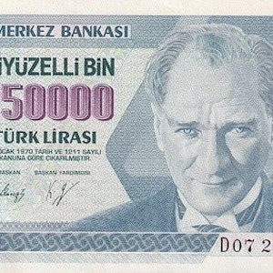 May include: A Turkish Lira banknote with a portrait of Mustafa Kemal Atatürk, the founder of modern Turkey. The note is blue and white with the text "İkiyüz Elli Bin 250000 Türk Lirası" printed in pink. The text "14 Ocak 1970 Tarih ve 1211 Sayılı Kanuna Göre Çıkarılmıştır." is printed in black below the portrait.
