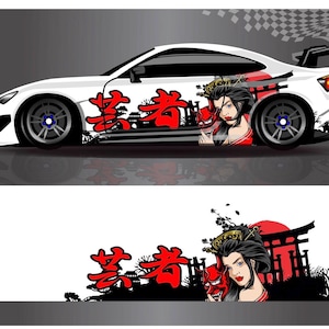 May include: White sports car with a Japanese geisha-themed graphic. The design includes red Japanese characters, a geisha with a red mask, and a red sun. The car has black wheels and a spoiler.