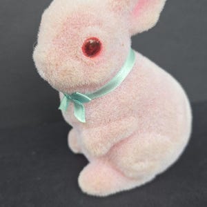 Vintage Pink Flocked Plastic Bunny Rabbit Coin Bank Red Eyes Green Bow Easter