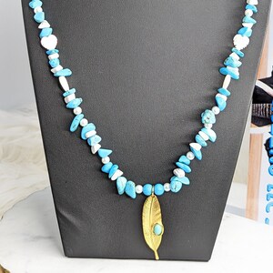 Turquoise, Howlite, Pearl, and Mother of Pearl Necklace with Feather Charm
