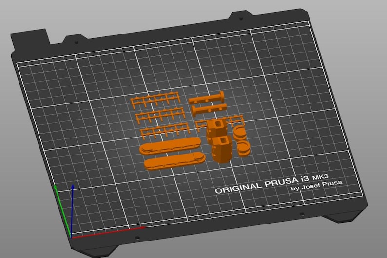Peut inclure: Mod&egrave;le orange imprim&eacute; en 3D de pi&egrave;ces, comprenant des formes rectangulaires et cylindriques, dispos&eacute;es sur une grille noire. Le texte "ORIGINAL PRUSA i3 MK3 by Josef Prusa" est visible sur la grille.