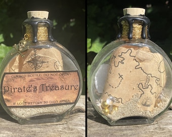 May include: A glass bottle with a cork stopper and a black wax seal. The bottle contains a rolled up piece of paper with a map and a skull and crossbones charm. The label on the bottle reads "Cursed Bottle: Do Not Open Pirate's Treasure If Lost, Return to Davy Jones."