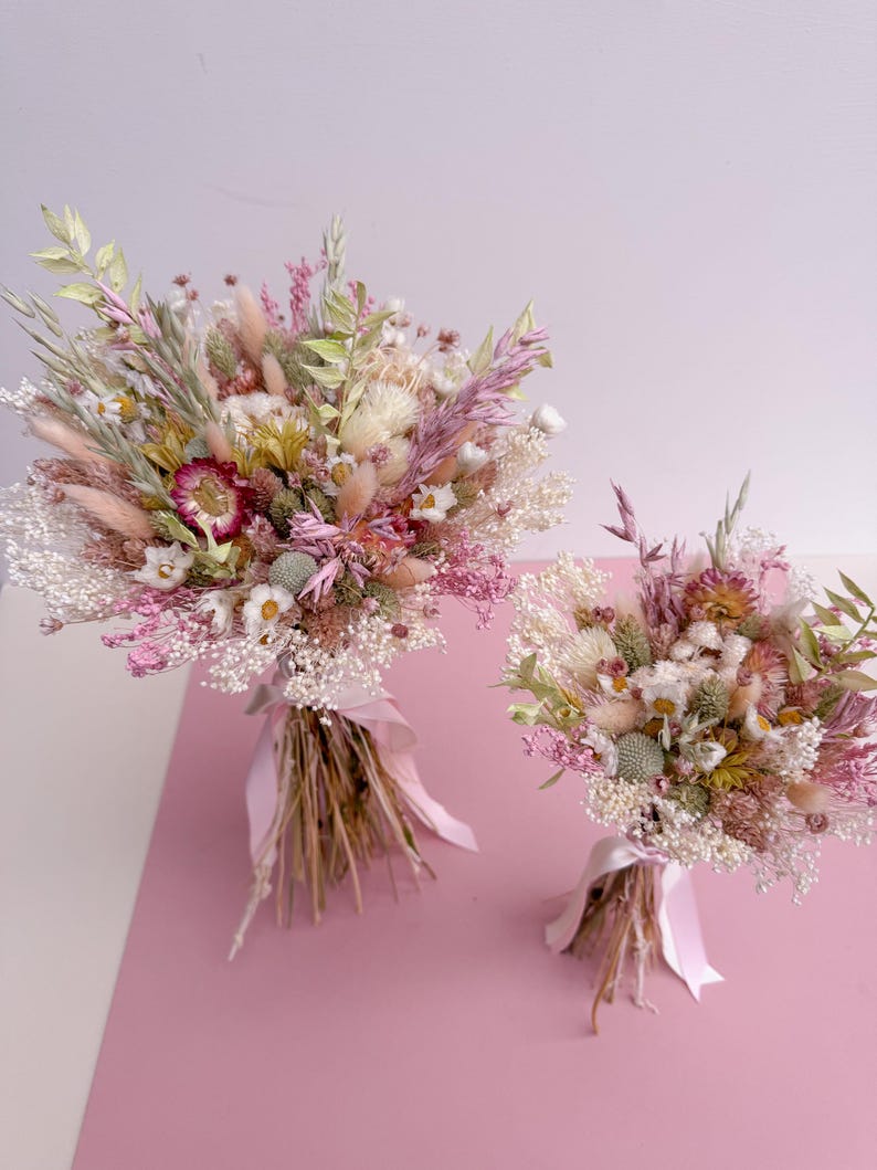 wildflower dried bouquet on pink background