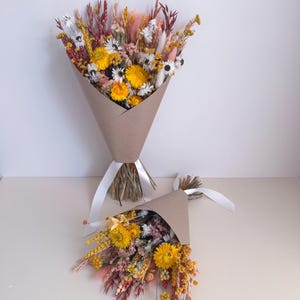 burnt orange arrangement with brown paper gift wrap