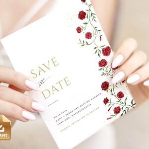 May include: Save the Date card with a white background and gold lettering. The card features a floral design with red roses and green vines. The text on the card reads "Save the Date" with the date "08.12.2024", the names "Mary & Jared", the location "Cape Cod, Massachusetts", and the phrase "Formal Invitation to Follow".