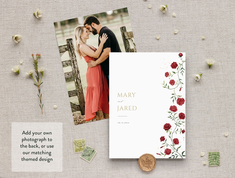 May include: A white wedding invitation with a gold border and the names "MARY and JARED" printed in gold. The invitation features a floral design with red roses and green leaves on the right side.