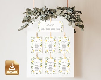 May include: Lemon themed wedding table seating chart with a white background and green eucalyptus leaves hanging from the top. The chart is made up of 8 cards with the text "Table One", "Table Two", "Table Three", "Table Four", "Table Five", "Table Six", "Table Seven", and "Table Eight" printed on each card. Each card features a watercolor illustration of lemons and leaves.