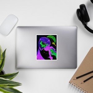 May include: A sticker featuring a digital illustration of a person with a black cat and a green bird. The person is wearing a purple cloak and has green and purple hair. The background is black with stars.