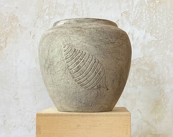 Distressed ceramic vase with leaf print