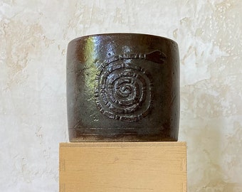 Glazed ceramic vase with snake print