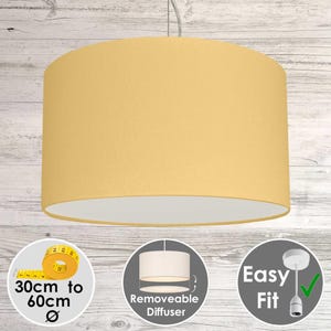 May include: A mustard yellow drum pendant light with a white interior. The light fixture has a removable diffuser and is easy to fit. The diameter is 30cm to 60cm.