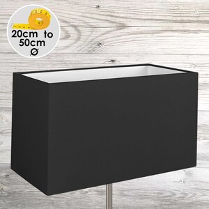 May include: A rectangular black lampshade with a white interior lining. A circular graphic in the upper left corner displays a yellow measuring tape and the text 20cm to 50cm Ø, indicating the available diameter range for this lampshade product.
