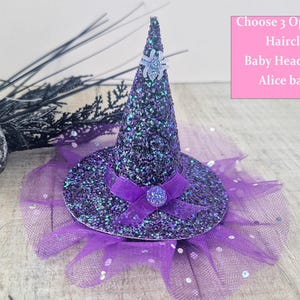 May include: Purple and black glitter witch hat with a tulle ruffle and a spider embellishment. Choose 3 options: Hair clip, Baby Headband, Alice band.