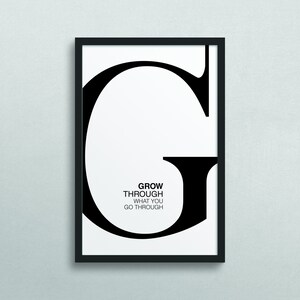 May include: Black and white framed print with a large letter G and the text "GROW THROUGH WHAT YOU GO THROUGH".