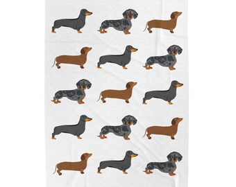 Puede incluir: Un fondo blanco con un patrón repetido de perros salchicha de varios colores, incluyendo negro, marrón y atigrado. Los perros están todos mirando hacia adelante y tienen la lengua fuera.