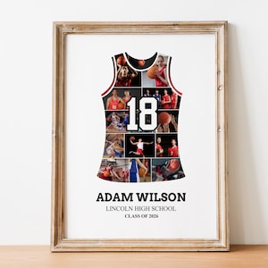 May include: Framed basketball jersey collage with photos of players in action. The jersey is white with a black outline and the number 18. The frame is a light brown color. The text at the bottom reads "ADAM WILSON, LINCOLN HIGH SCHOOL, CLASS OF 2026."