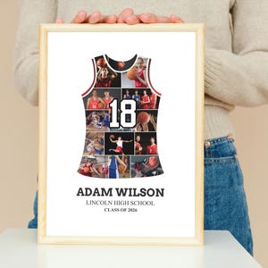 May include: A framed basketball jersey collage with the name "Adam Wilson", "Lincoln High School", and "Class of 2026" printed at the bottom. The jersey-shaped collage features photos of basketball players and the number "18". The frame is made of light-colored wood.
