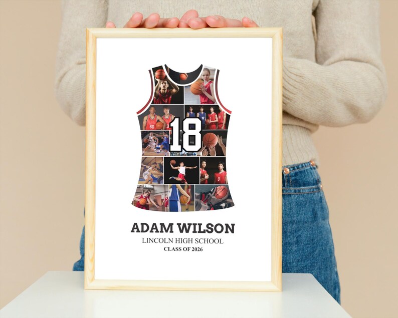 May include: A framed basketball jersey collage with the name "Adam Wilson", "Lincoln High School", and "Class of 2026" printed at the bottom. The jersey-shaped collage features photos of basketball players and the number "18". The frame is made of light-colored wood.