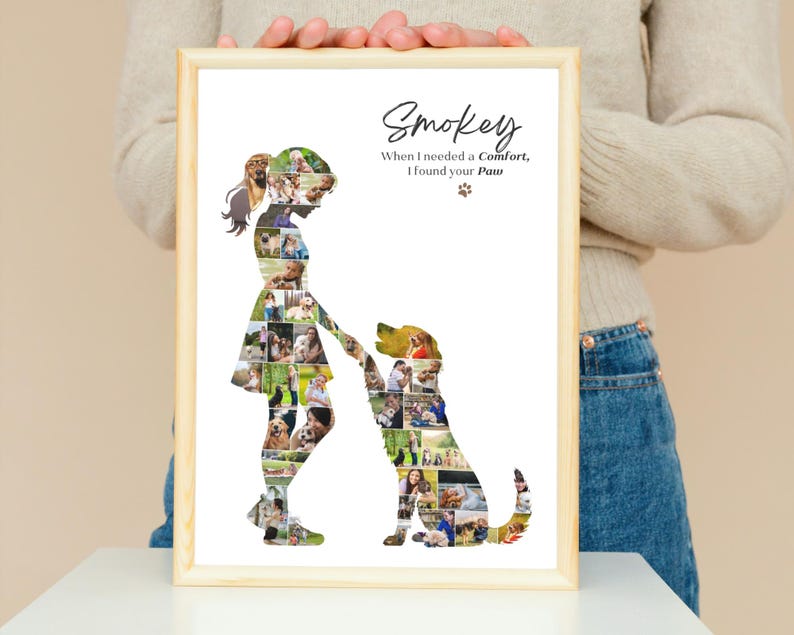 May include: A framed print featuring a collage of photos shaped into the silhouettes of a person and a dog. The text reads: Smokey, When I needed a Comfort, I found your Paw. The design is set against a white background within a light wood frame.