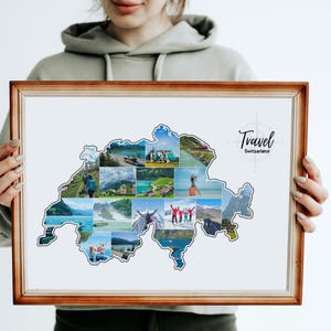 May include: A framed print showing a collage of images in the shape of Switzerland. The collage includes various scenic views and people. The frame is a light brown colour, and the print has the words "Travel Switzerland" in black script.