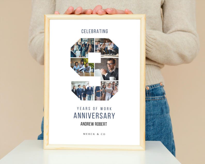 May include: A white framed poster with a collage of photos in the shape of the number nine. The text "Celebrating 9 Years of Work Anniversary Andrew Robert Merck & Co" is printed on the poster.